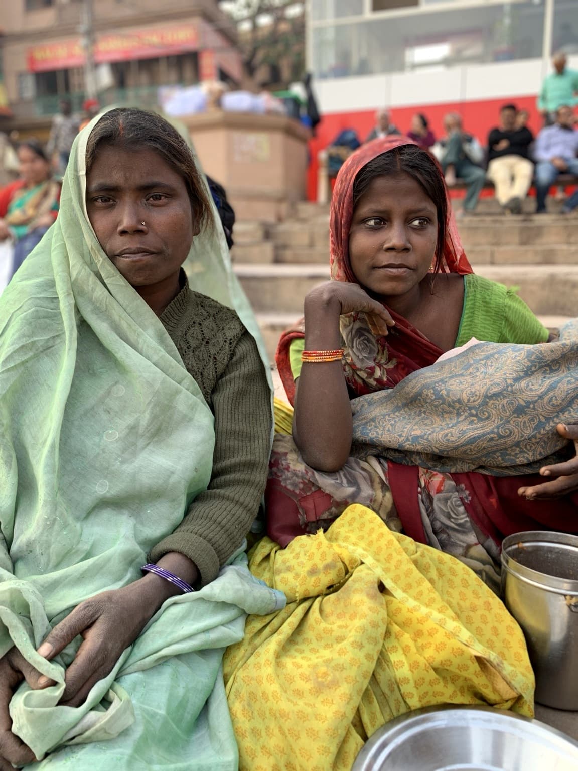 Two people share the frame during an encounter on the ghats of Varanasi, 2019.