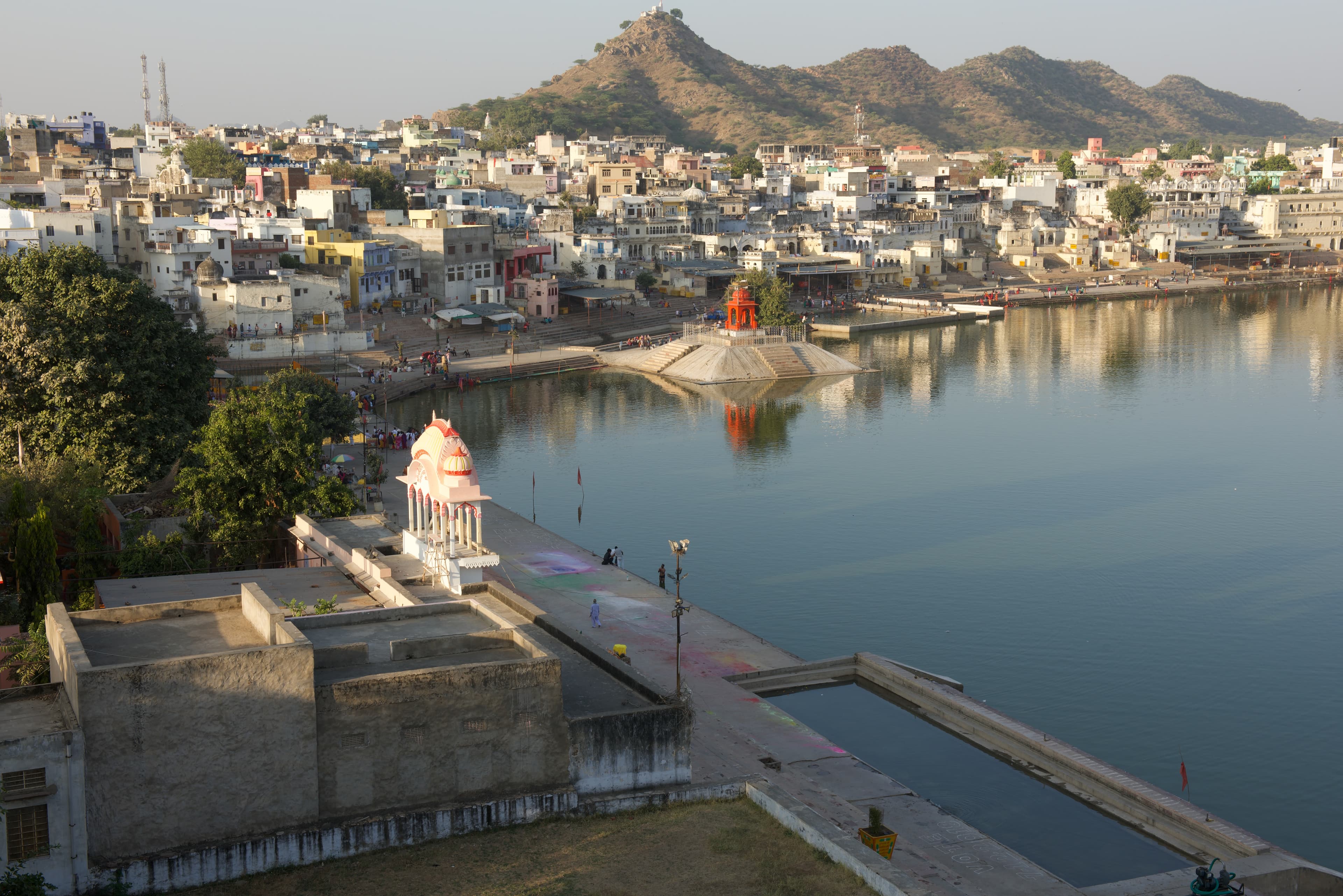 Ghats and lakeside buildings extend towards the hills around Pushkar.